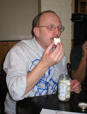 Les Collings eats a pickled egg.