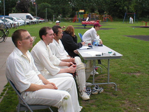 Mike Jones, Joe White, Daniel Mortlock, the Girton scorer and 
    John Young watch the game.