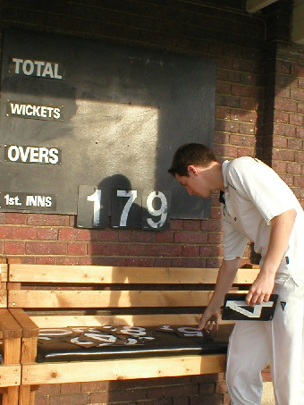 Guy Wiedermann updating the scoreboard.